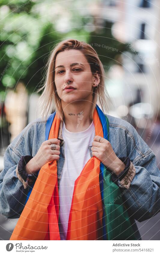LGBT woman on city street lgbt flag young urban lesbian lifestyle leisure female colorful rainbow rights equality homosexual pride freedom town activist lady