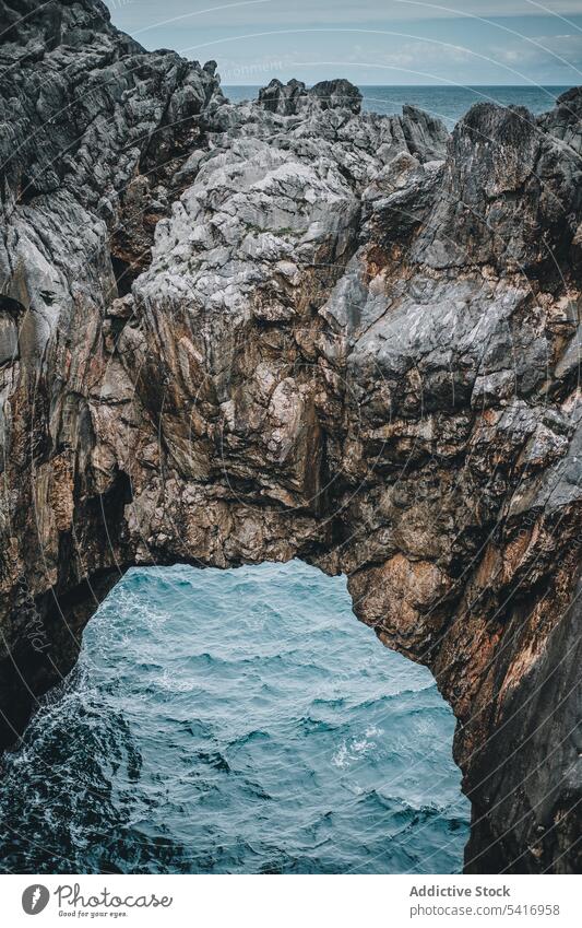 Picturesque rocks and sea cliff arch cave landscape natural passage water hole picturesque peaceful breathtaking tranquil calm idyllic scenic high beautiful