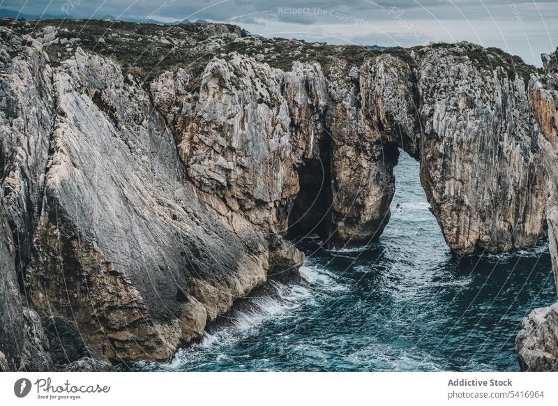 Picturesque rocks and sea cliff arch cave landscape natural passage water hole picturesque peaceful breathtaking tranquil calm idyllic scenic high beautiful