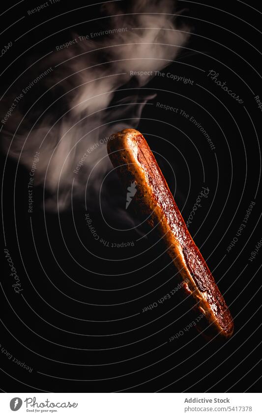 smoke around delicious grilled sausage in a black background clipping path meal gastronomy unhealthy close-up roasted meat prepared ingredient fried restaurant