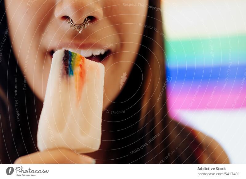 Woman eating ice cream with LGBT symbol lgbt sweet freedom equality rights dessert tolerance rainbow colorful bright concept lesbian pleasure bisexual