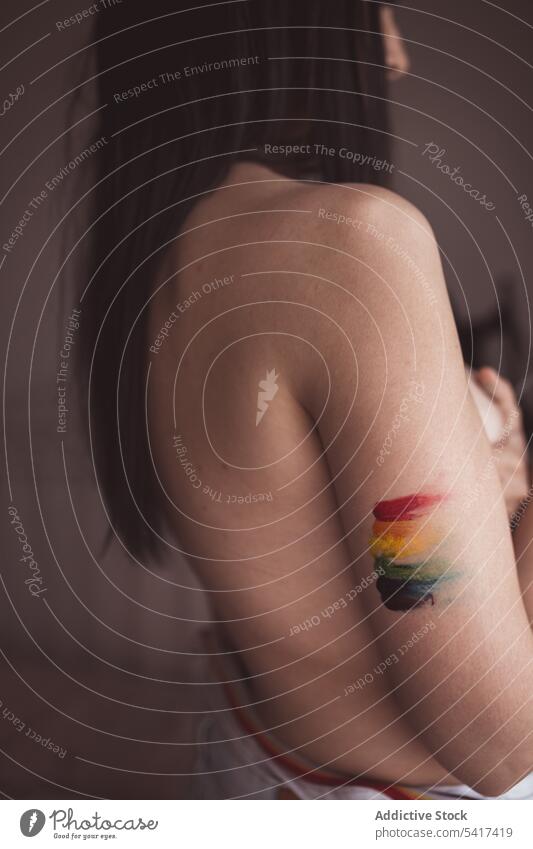 Attractive naked woman covering breast and drawing LGBT symbol beautiful lgbt sensual serious freedom equality rights female tolerance creative rainbow colorful