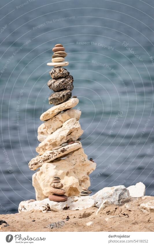 Stacked stone on beach in Denmark Structures and shapes Nature reserve Subdued colour Copy Space left Copy Space right Copy Space top Central perspective