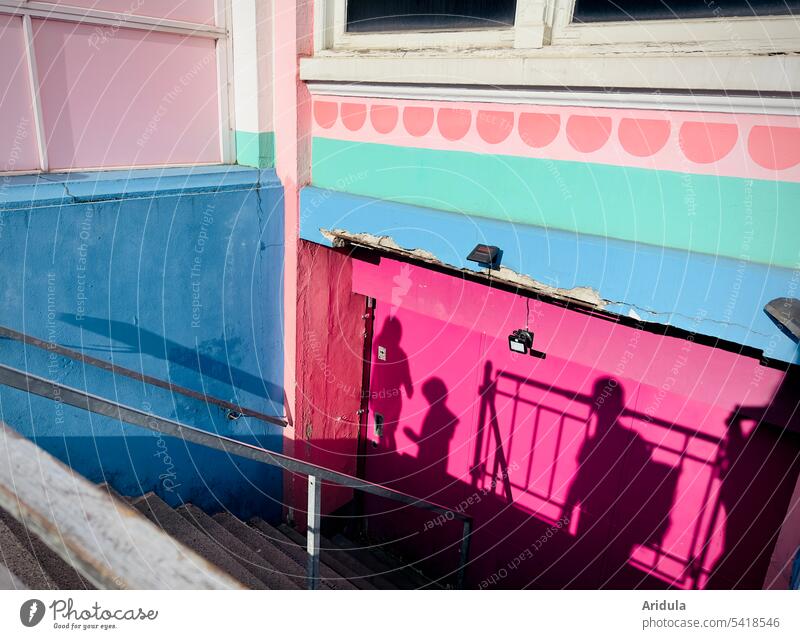 Person shadow on colorful painted house wall Shadow people variegated Wall (building) Facade House (Residential Structure) Architecture Blue pink Sunlight