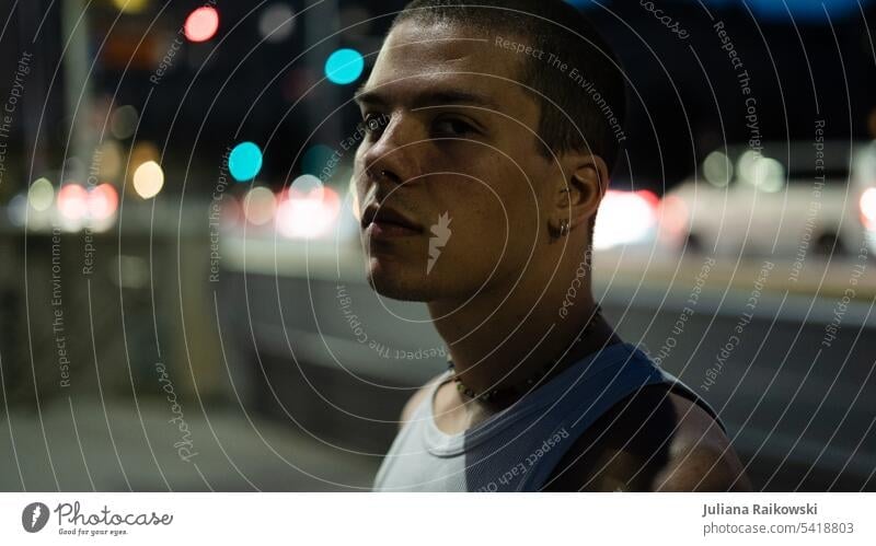 Portrait of a young man at night in the city night walk Street lighting Hip & trendy Looking street style street photography urban Town nightly Face