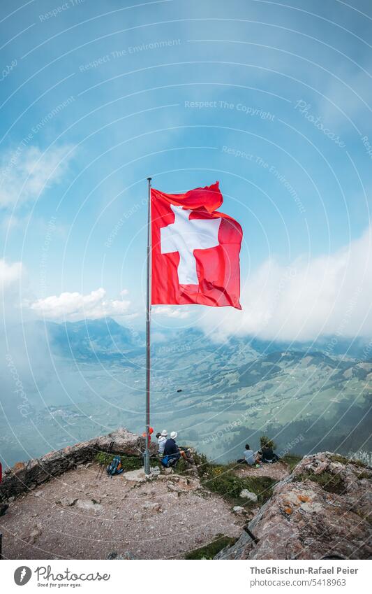 Swiss flag with view of the surroundings Grass big myths swiss flag Flag Switzerland Tourism Mountain Alps Colour photo Hiking Landscape Exterior shot mountains