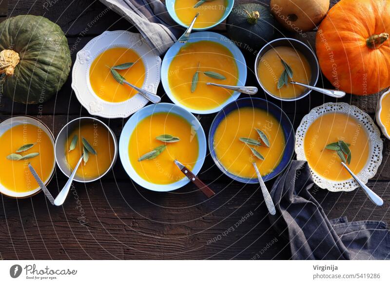 Thanksgiving concept with pumpkin, pumpkin soup .Fall table setting for celebration Autumn holiday with soup. food halloween ingredient lunch meal november