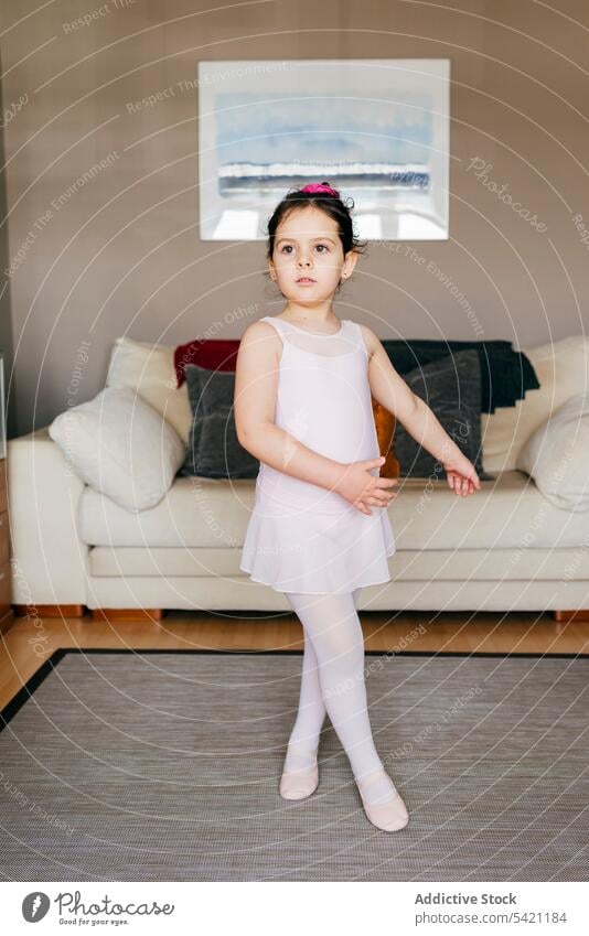 Little ballerina dancing at home girl dance ballet rehearsal living room cozy sofa little child kid exercise training childhood perform couch class grace