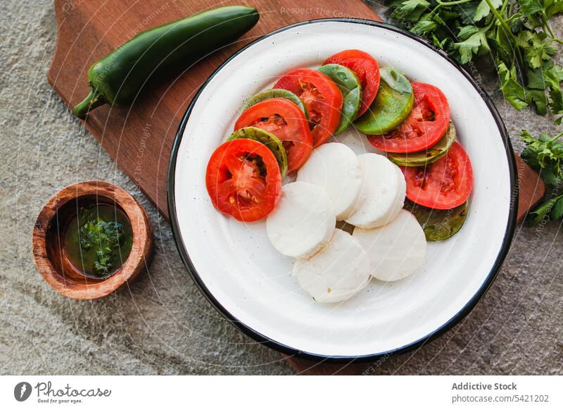 Diet caprese salad with jalapeno pepper vegetable tomato cheese mozzarella board green snack dinner healthy cuisine diet eat vegetarian super food healthy food