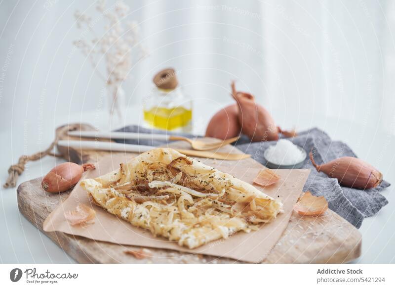 Puff pastry with onion and cream cheese on table puff cutting board dish rustic ingredient food snack delicious fresh meal homemade gourmet prepare cook cuisine