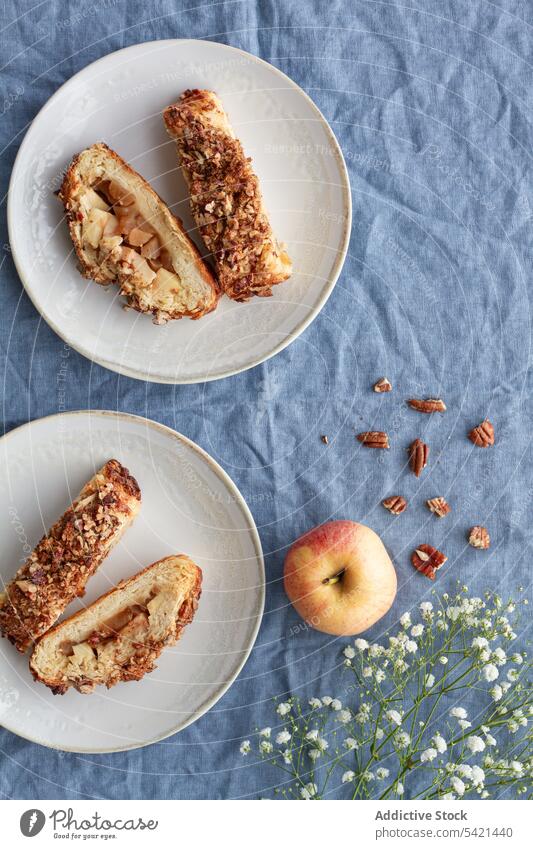 Tasty apple pie pieces on saucers near ingredients pastry sweet treat menu slice baked yummy pecan delicious crispy fabric crunchy nut nutrient protein soft