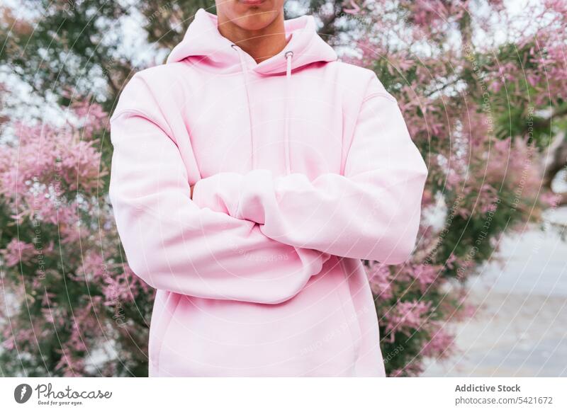 Anonymous ethnic guy in pink hoodie man style hipster trendy modern color outfit confident young afro millennial male serious african american black fashion
