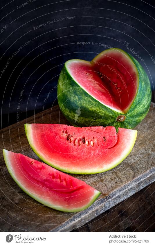 Juicy watermelon on wooden table slice fruit sweet summer delicious ripe fresh food healthy vitamin organic vegan nutrition natural raw piece vegetarian yummy