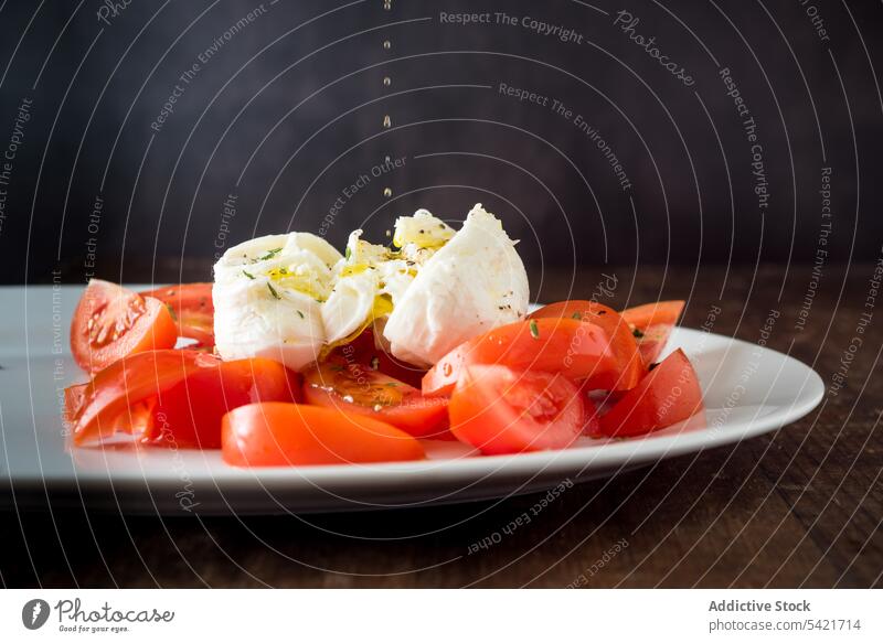 Fresh tomatoes with burrata cheese on plate mozzarella vegetable ripe serve delicious fresh food nutrition healthy tasty meal slice vegetarian ingredient