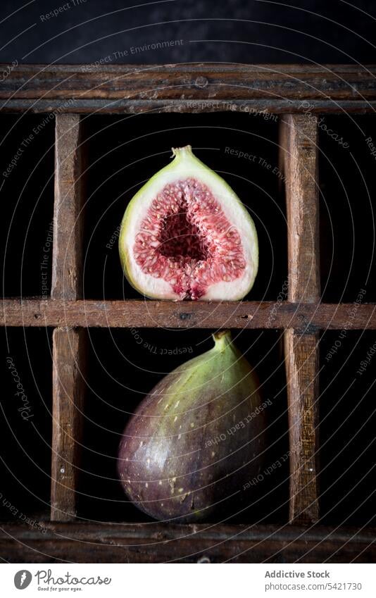 Ripe figs placed on wooden shelf fruit rustic ripe fresh whole half healthy food vitamin natural organic nutrition tasty arrangement layout composition