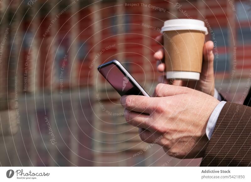 Aged businessman with coffee using smartphone gadget takeaway cup beard modern mature middle age executive gray hair browsing message drink communicate mobile