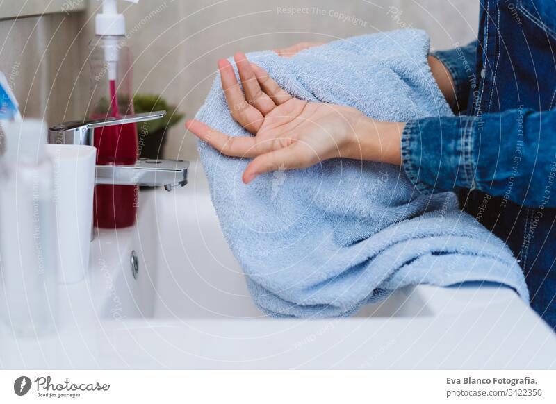 unrecognizable woman drying hands with towel after washing with soap. Coronavirus covid-19 concept corona virus stay home alcohol hygiene personal sink sanitary