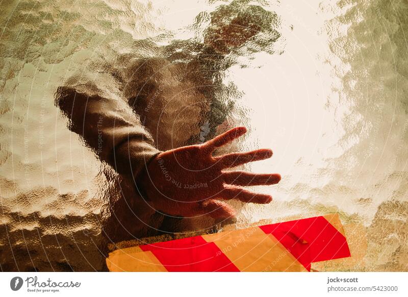 Unknown man puts his hand on the glass pane Man Human being Identity Pane blurriness Transparent background hazy behind glass Silhouette Deformation perception
