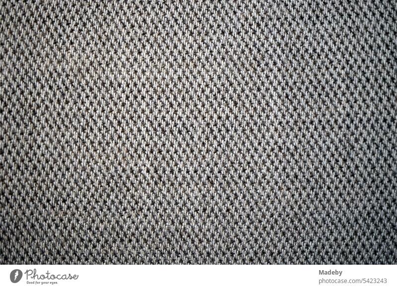 Finely patterned upholstery fabric in gray and natural colors for elegant seating furniture in a museum at the Unesco World Heritage Zollverein Coal Mine Industrial Complex m Stoppenberg district of Essen in the Ruhr region of Germany
