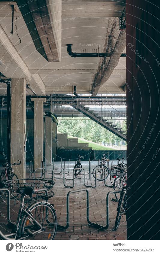 Bicycle stand under a concrete structure Bicycle rack "Bicycle stand metal pipe Symmetry bicycle holder Town Bicycle lot Parking lot wheel stand steel pipe
