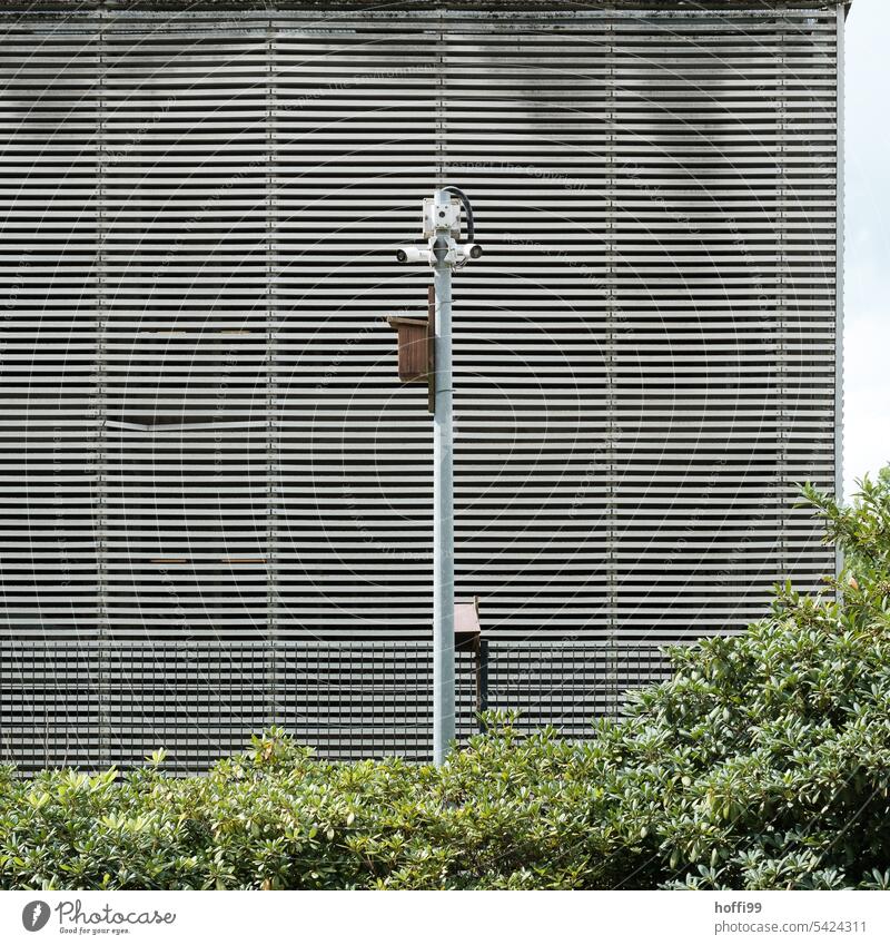 Surveillance camera in front of striped façade Camera Testing & Control Surveillance device Police state Facade Monitoring Technology Observe Video camera