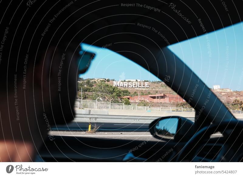 Arrival in Marseille with view out of the car window to the city's lettering Southern France Provence Planète Mars Marseille Sign Town road trip Man Eyeglasses
