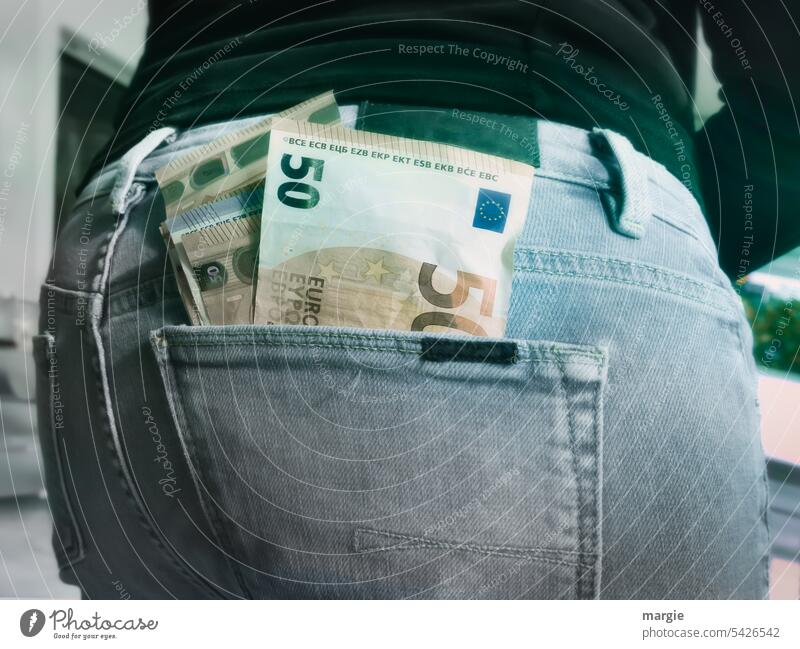 Banknotes in the pocket Bank note Trouser pocket Jeans Woman Pants Detail 50 euros assets Bar concept Purchasing power finance Notes Loose change Consumption