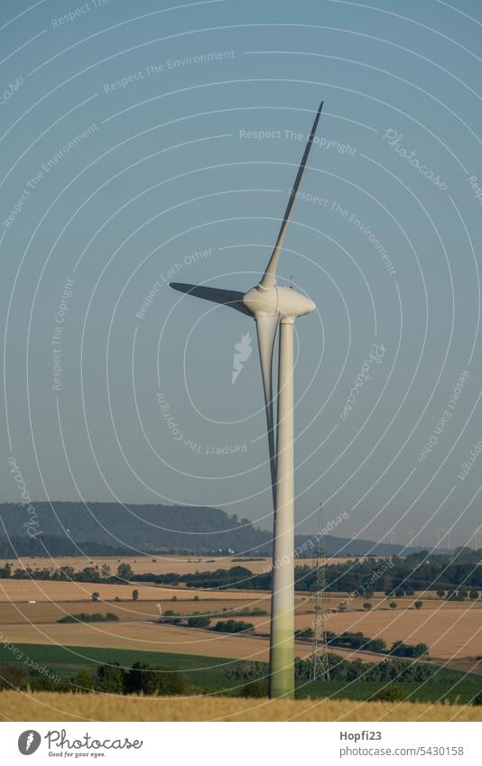 Wind turbine on a field Wind energy plant Sky Energy industry Electricity Renewable energy Eco-friendly Environmental protection Ecological Alternative