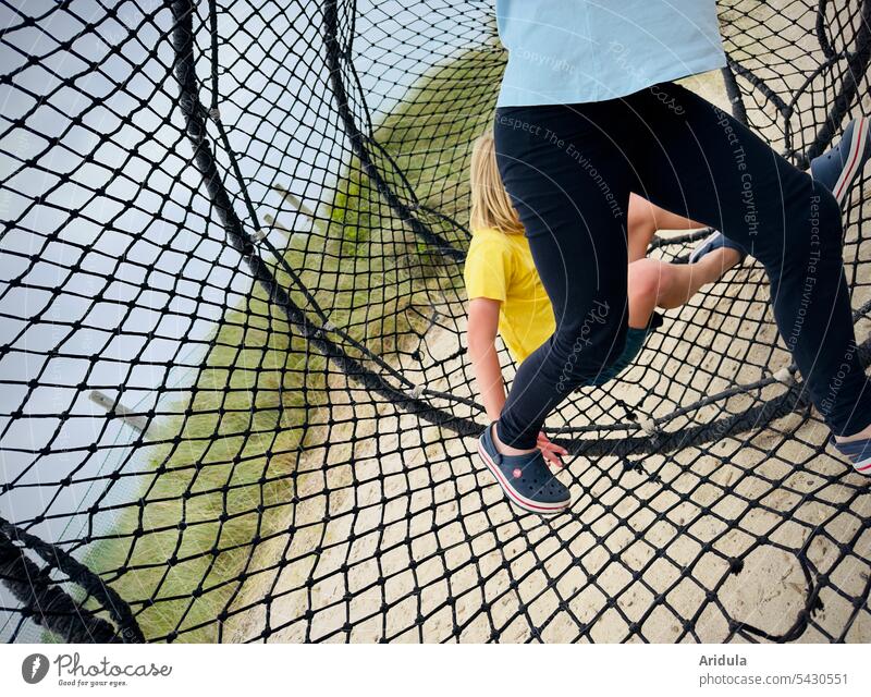 Two children in the "net Child Playground Infancy Playing game device Outdoors fun Joy Summer Net Rotate Movement