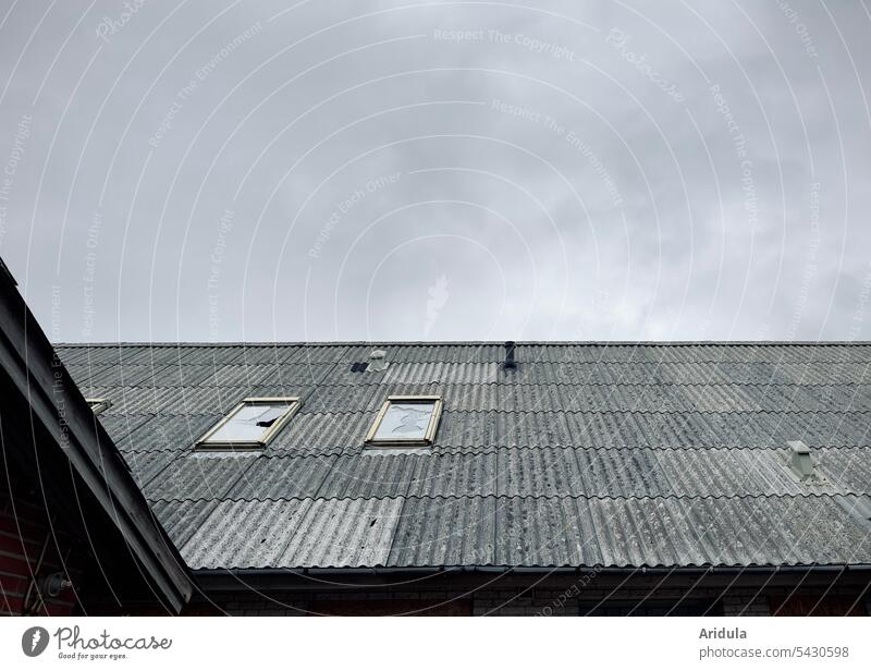 Corrugated metal roof with broken skylights under gray cloudy sky Roof Corrugated iron roof Skylight House (Residential Structure) Broken Window Building