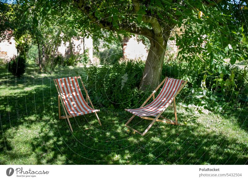 #A0# Chairs in the garden allotment Garden local recreation Lie relax local recreation area Tourist To enjoy Sunbathing Sunlight Deckchair Well-being Tourism