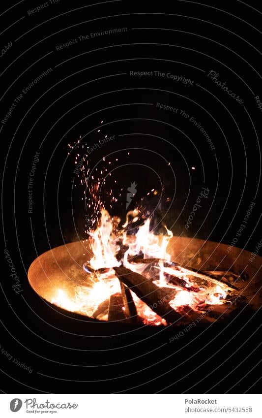 #A0# Fire and so campfire fire bowl out Summer at night Burn Hot Fireplace Flame Wood Warmth Embers Glow Firewood Exterior shot Spark Incandescent ardor Orange
