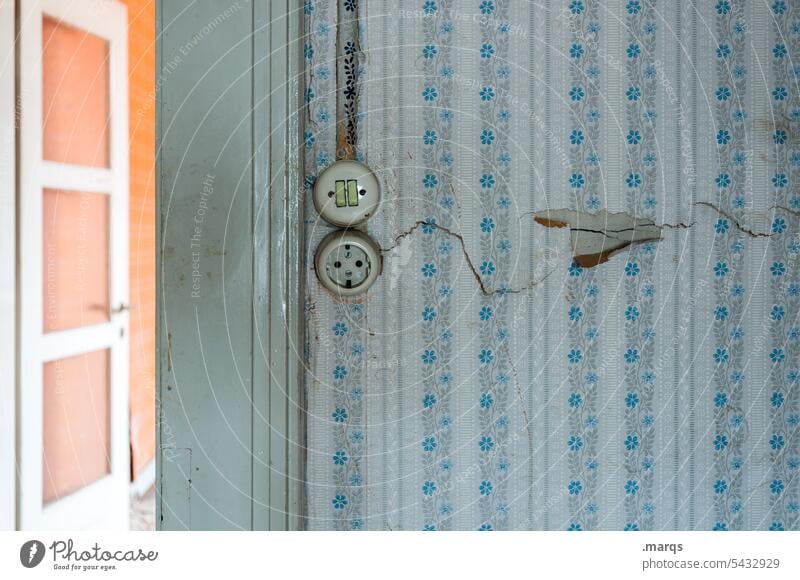 change of scenery Light switch Old Wallpaper Retro Wallpaper pattern Transience Wall (building) Decline Past In need of renovation Redecorate Change of scene