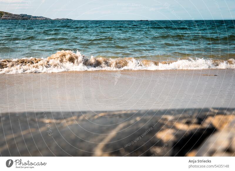 Waves play on the beach of Grense Jakobselv Water Exterior shot Color photo Colour photo color photograph Photography Stone Body of water Sea and stone Seashore