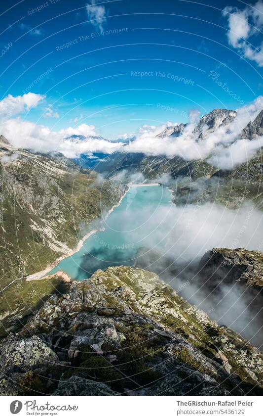 Mountain lake with clouds and mountains in background Clouds Sky Clouds in the sky Exterior shot Landscape Deserted Colour photo Nature Alps Day Blue Gray rocky