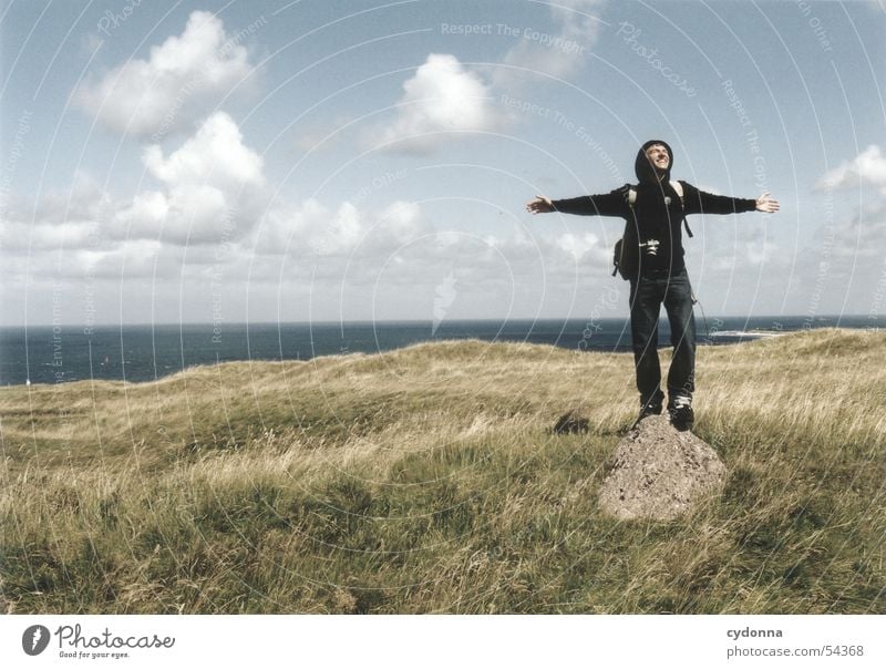 Freedom! Man Posture Clouds Meadow Ocean Emotions Release Impression Summer Human being Landscape Sky Stone North Sea Helgoland Wind Facial expression