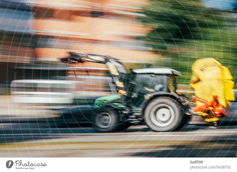 speeding tractor in the city Tractor Leadfoot Frenzy Town urban motion blur Unsharp blurred vibrating Hazy hazy abstract photography ICM technology Unclear