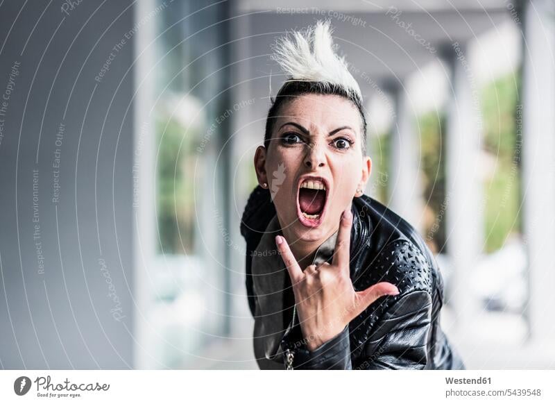 Portrait of screaming punk woman at an arcade shouting punks portrait portraits arcades females women subculture people persons human being humans human beings