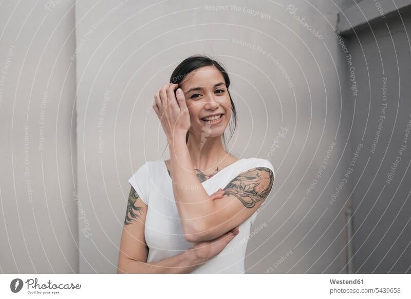 Portrait of a young woman with tattoos, smiling females women cheerful gaiety Joyous glad Cheerfulness exhilaration merry gay portrait portraits Adults