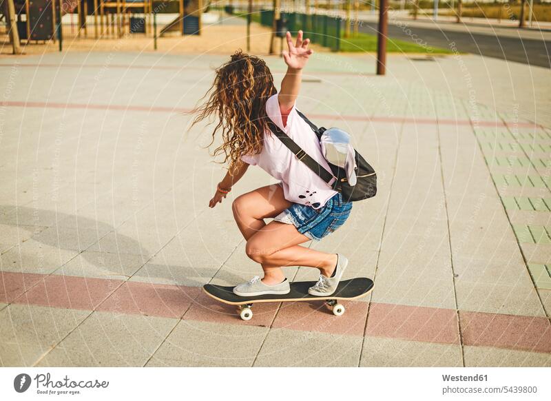 Girl with skateboard Skate Board skateboards skill Ability skilled leisure free time leisure time female skateboarder female skater female skateboarders Balance