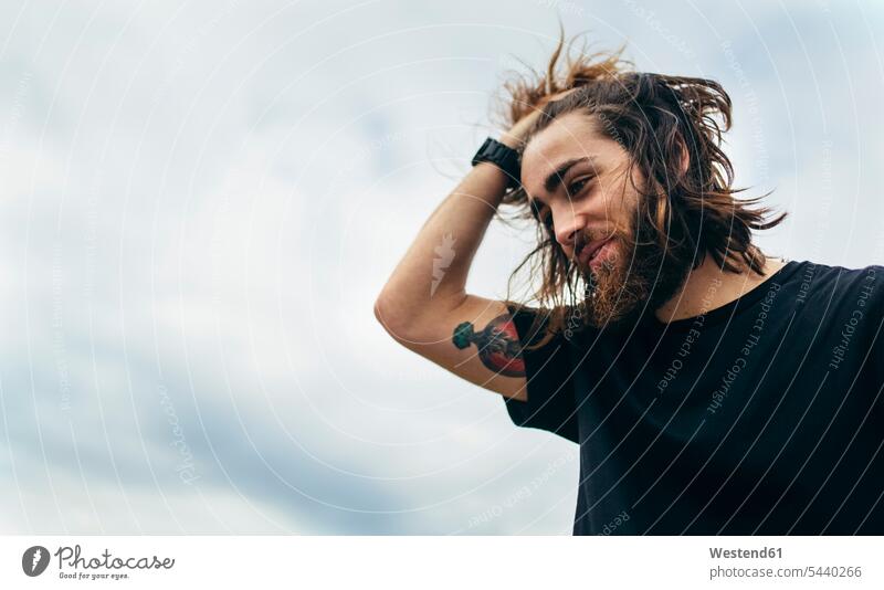 Portrait of bearded young man with tattoo on his upper arm caucasian caucasian ethnicity caucasian appearance european Memory memories daydreaming day dreaming