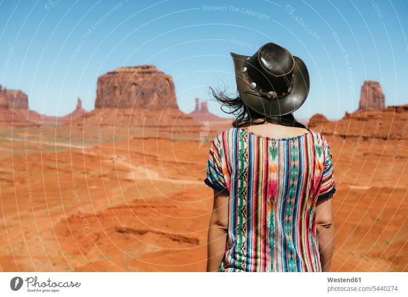 USA, Utah, Woman with cowboy hat enjoying the views in Monument Valley Looking At View Looking at a view Wanderlust Itchy Feet woman females women cowboy hats