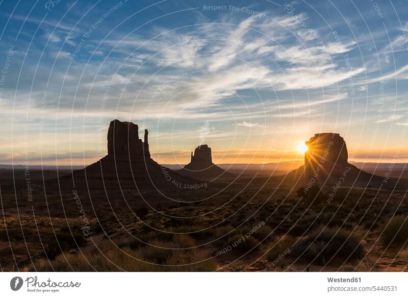 USA, Colorado Plateau, Utah, Arizona, Navajo Nation Reservation, Monument Valley, The View Campground with West Mitten Butte, East Mitten Butte and Merrick Butte at sunrise
