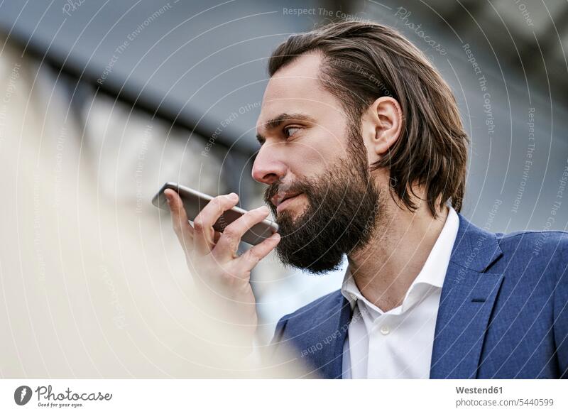 Businessman using cell phone Business man Businessmen Business men mobile phone mobiles mobile phones Cellphone cell phones business people businesspeople