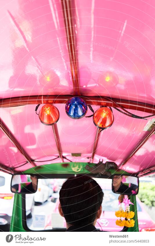Thailand, Bangkok, back view of driver in his tuk-tuk taxi Asian Ethnicity Asians journey travelling Journeys voyage rear-view mirror Rear Mirror