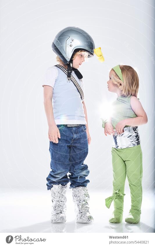 Boy dressed up as spaceman getting in contact with girl dressed up as alien fancy dress fancy-dress costume Fancy Dress Costumes disguise costumes boy boys