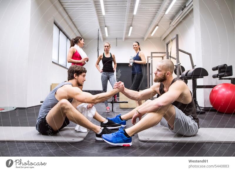 Athletes having a break from exercising in gym exercise training practising gyms Health Club fitness sport sports Fitness Recreational Pursuit