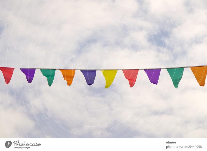 colorful pennant chain in front of slightly cloudy sky Paper chain Fabric garland variegated Colour colored celebration Adorned Firm celebrate with a party