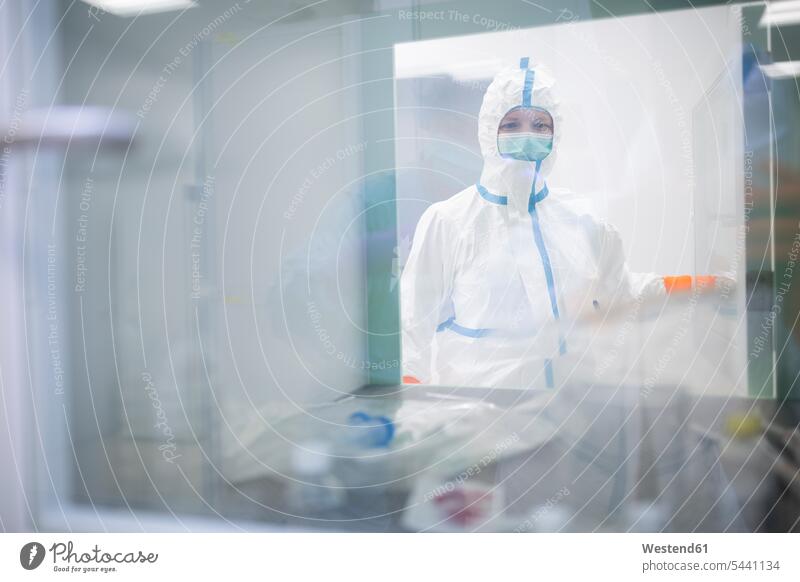 Lab technician wearing cleanroom overall at material sluice science sciences scientific working At Work laboratory technician Lab Tech scientist workplace