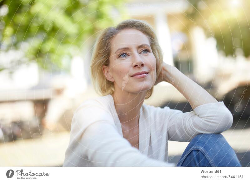 Portrait of smiling blond woman looking at distance portrait portraits females women Adults grown-ups grownups adult people persons human being humans